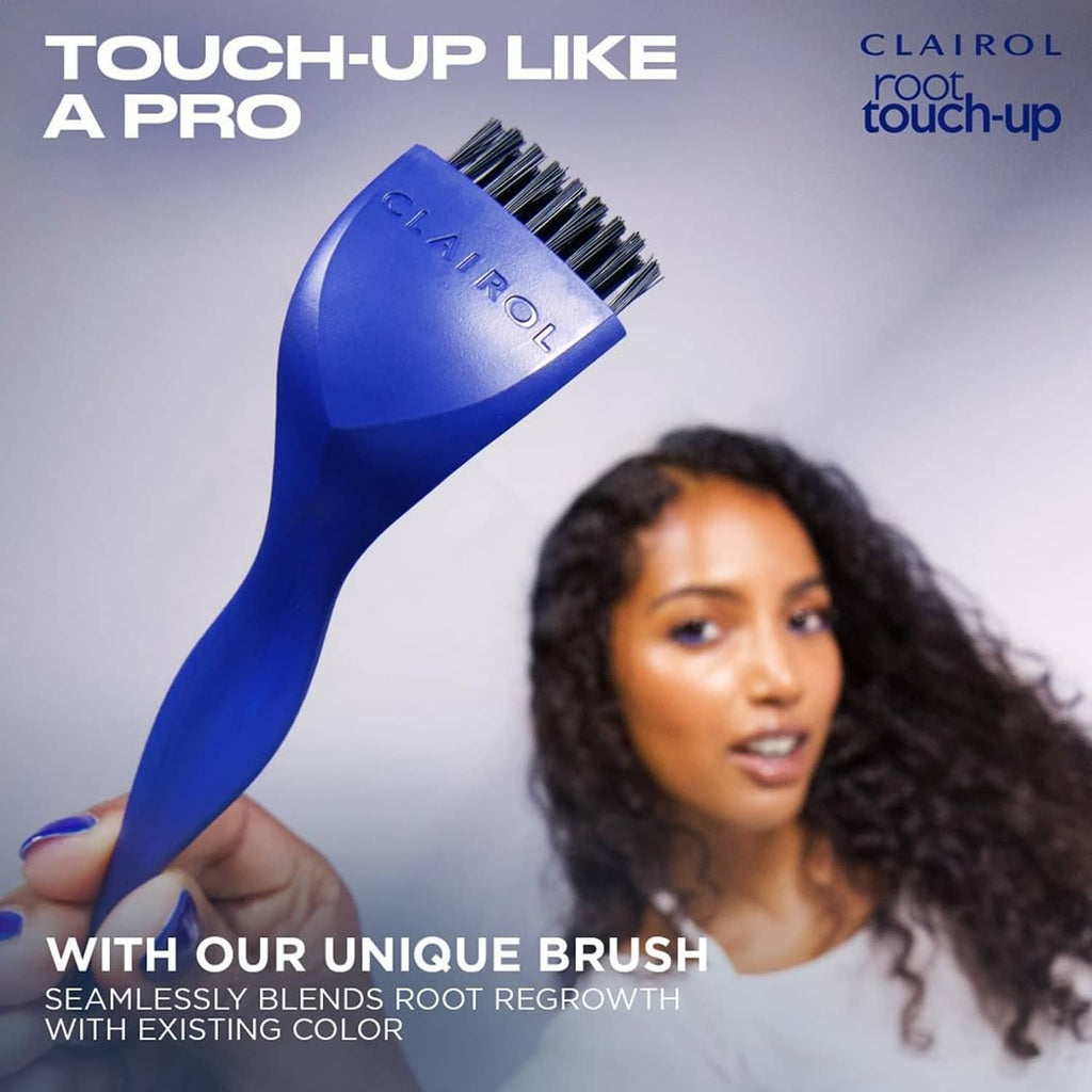 Clairol root touch-up blue mixing brush held over hair, touch-up tool