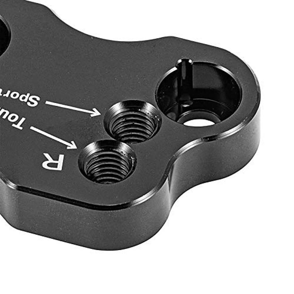 Close-up of black riser adapter showing two threaded studs and a mounting cup