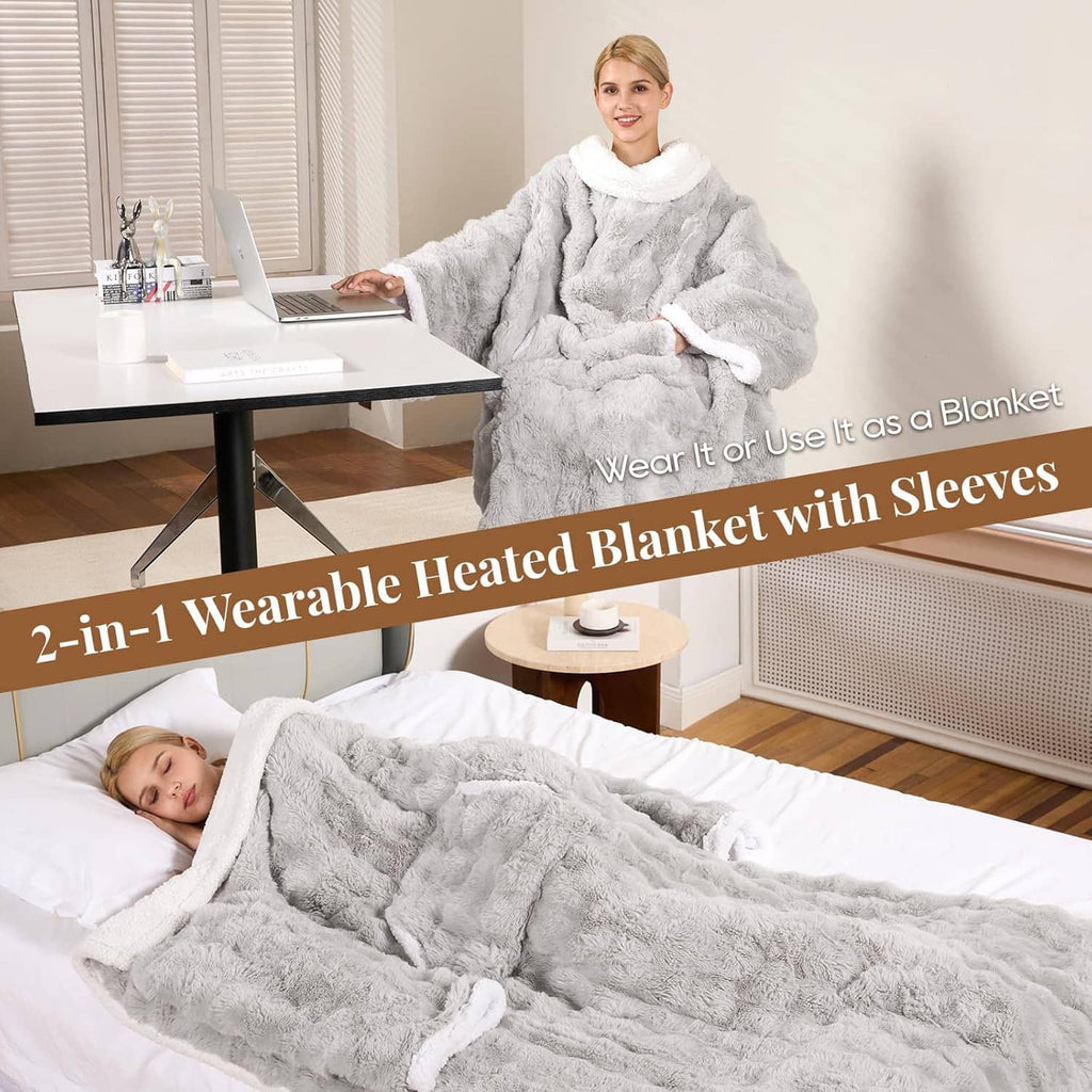 Light gray wearable heated blanket robe with hood and sleeves, worn while lounging
