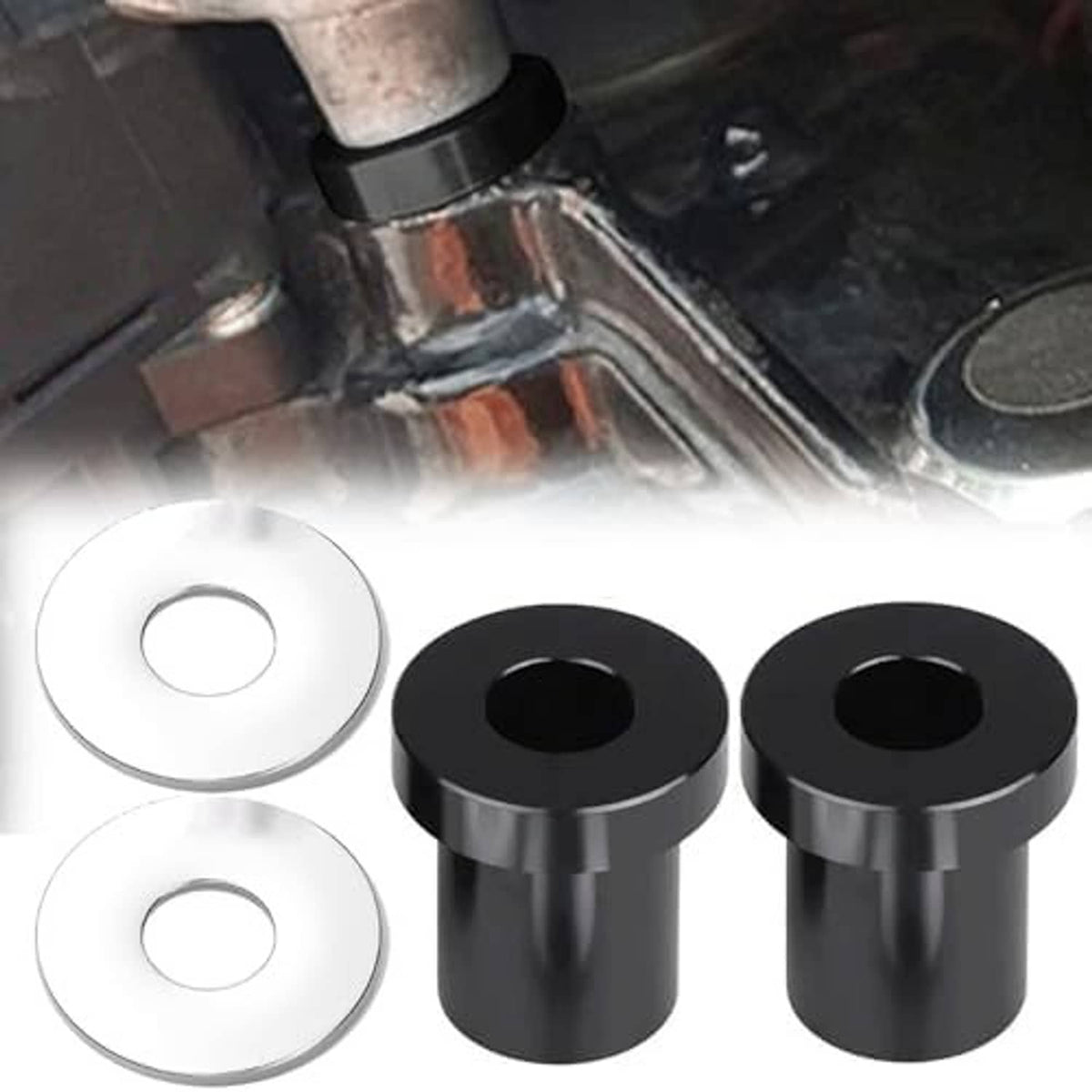 Set of two black handlebar riser bushings beside two silver washers for installation