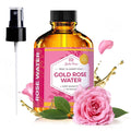 Gold rose water toner bottle with pink label and spray pump, with rose petals nearby