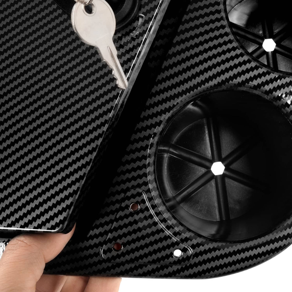 Carbon-fiber style golf cart dash compartment with speaker grille opening and keys area