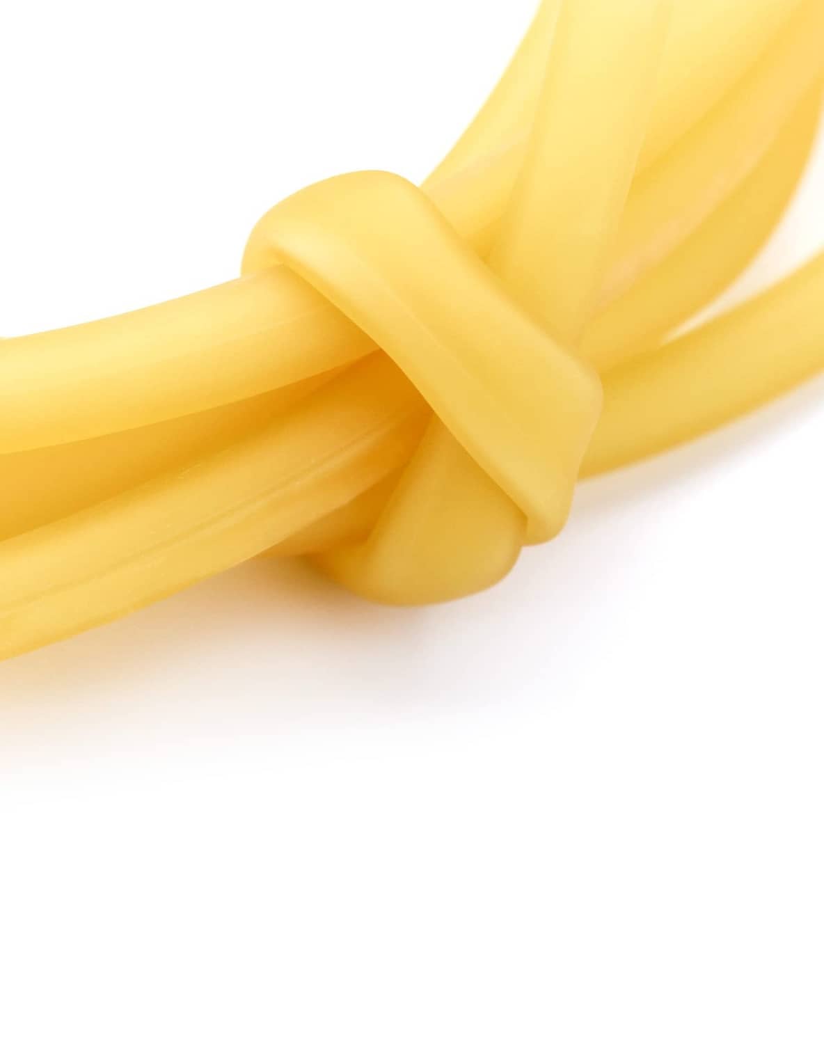 Natural latex rubber tubing, close-up of twisted yellow section