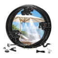 Black misting line with adjustable 360° nozzles spraying over patio umbrella