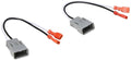 Gray car audio wiring harness adapter with orange connectors and dual plugs