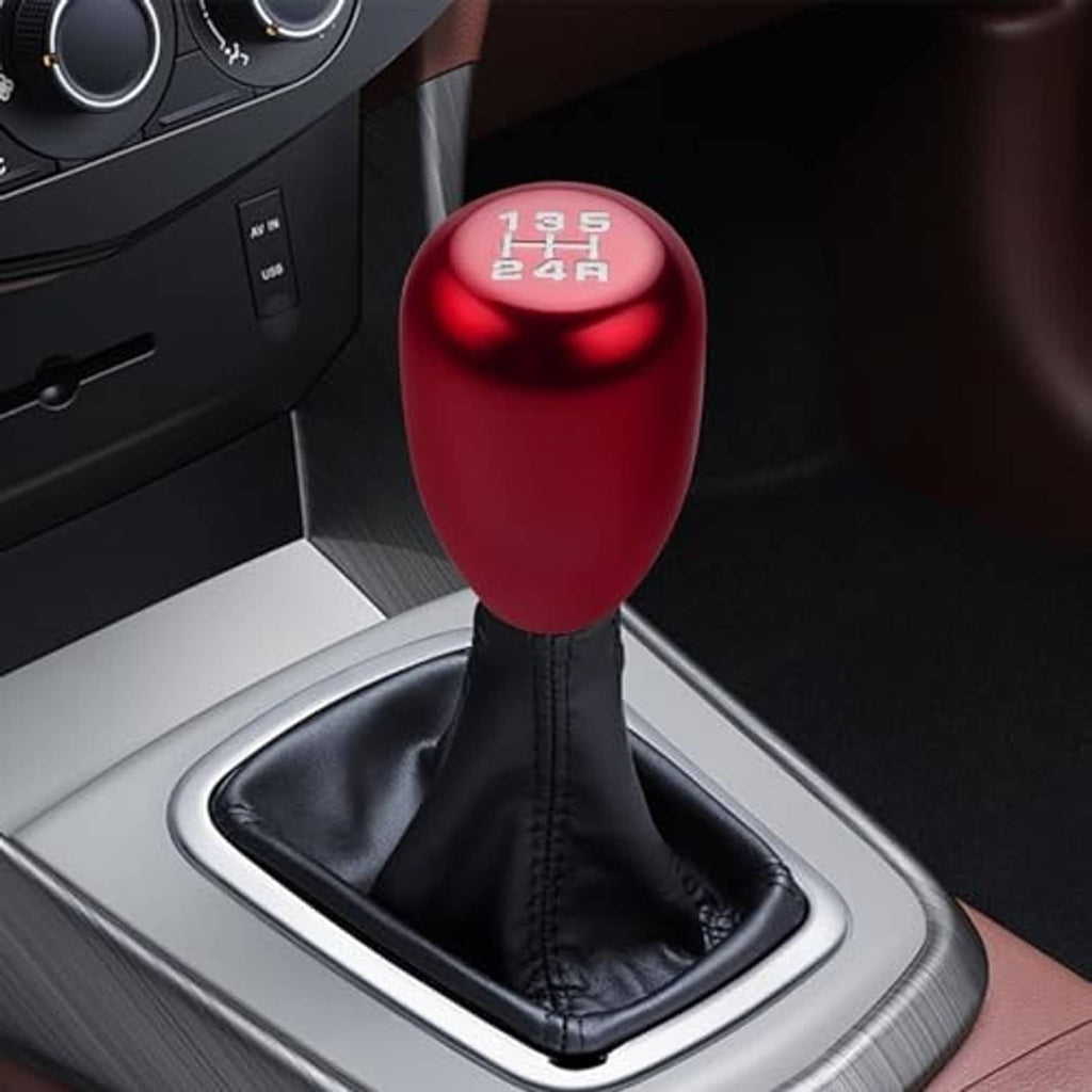 Red 5-speed gear shift knob on black leather boot with engraved 1-5 and R