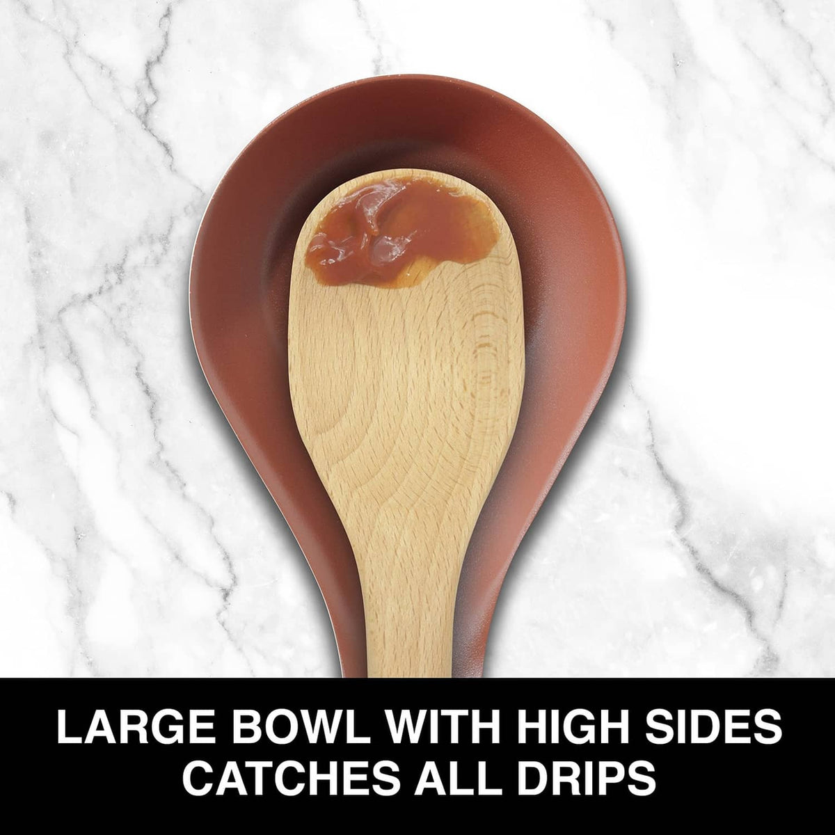 Brick-red spoon rest with high sides holding a wood spoon with a spoonful of sauce