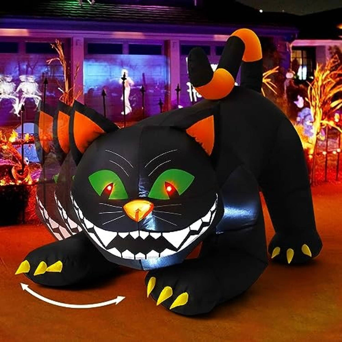 Large inflatable black cat yard decoration with orange ears and glowing green eyes