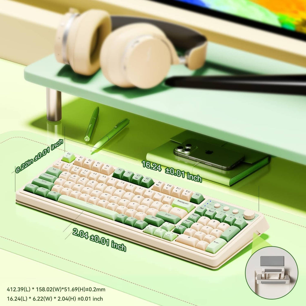 Green and cream gaming keyboard close-up with rotary knob and side controls.