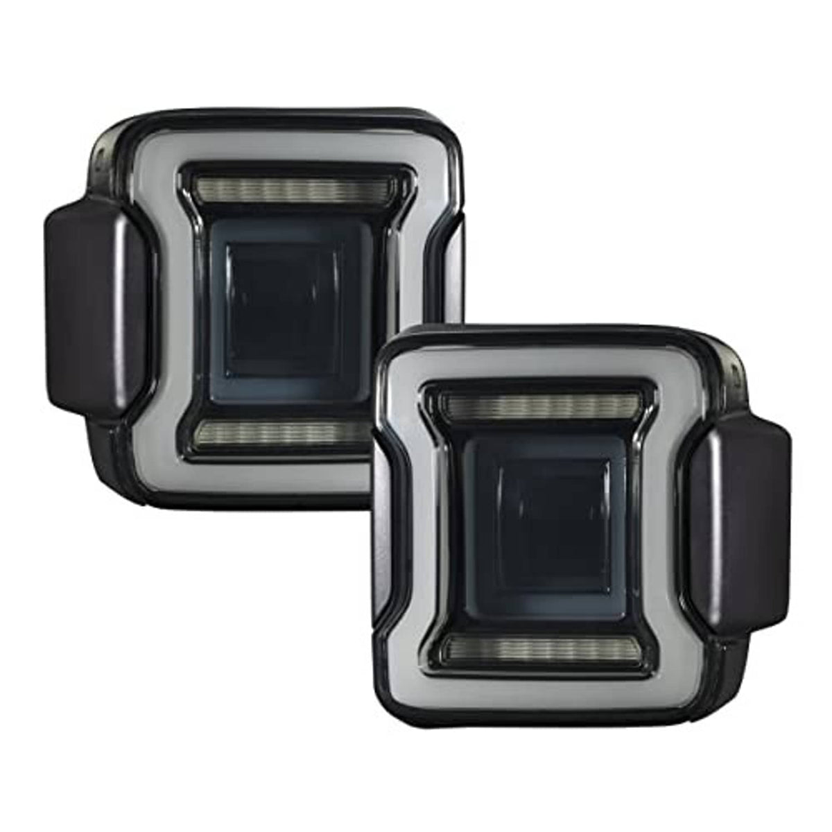 Pair of smoked LED tail lights with chrome trim, square lens windows, and side housings