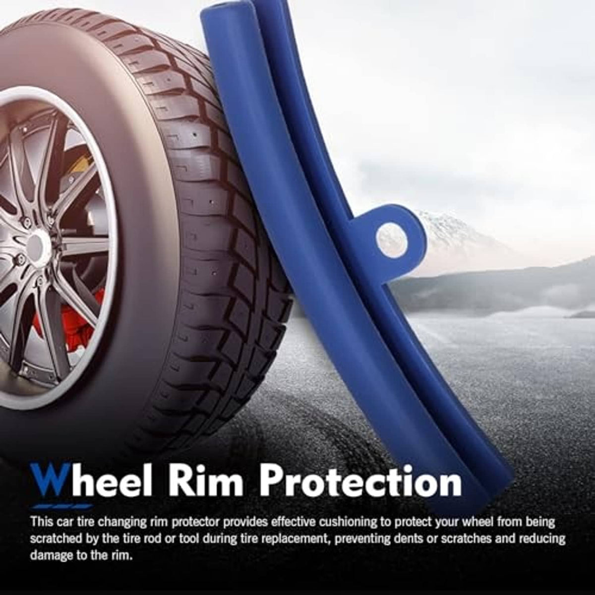 Blue tire rim protector bar with orange rope loop beside wheel edge