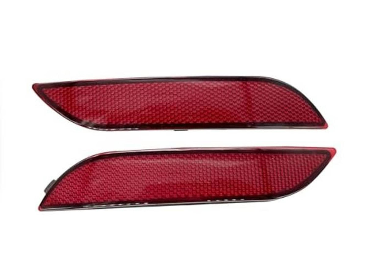 Red rear bumper reflector lens pair with textured surface