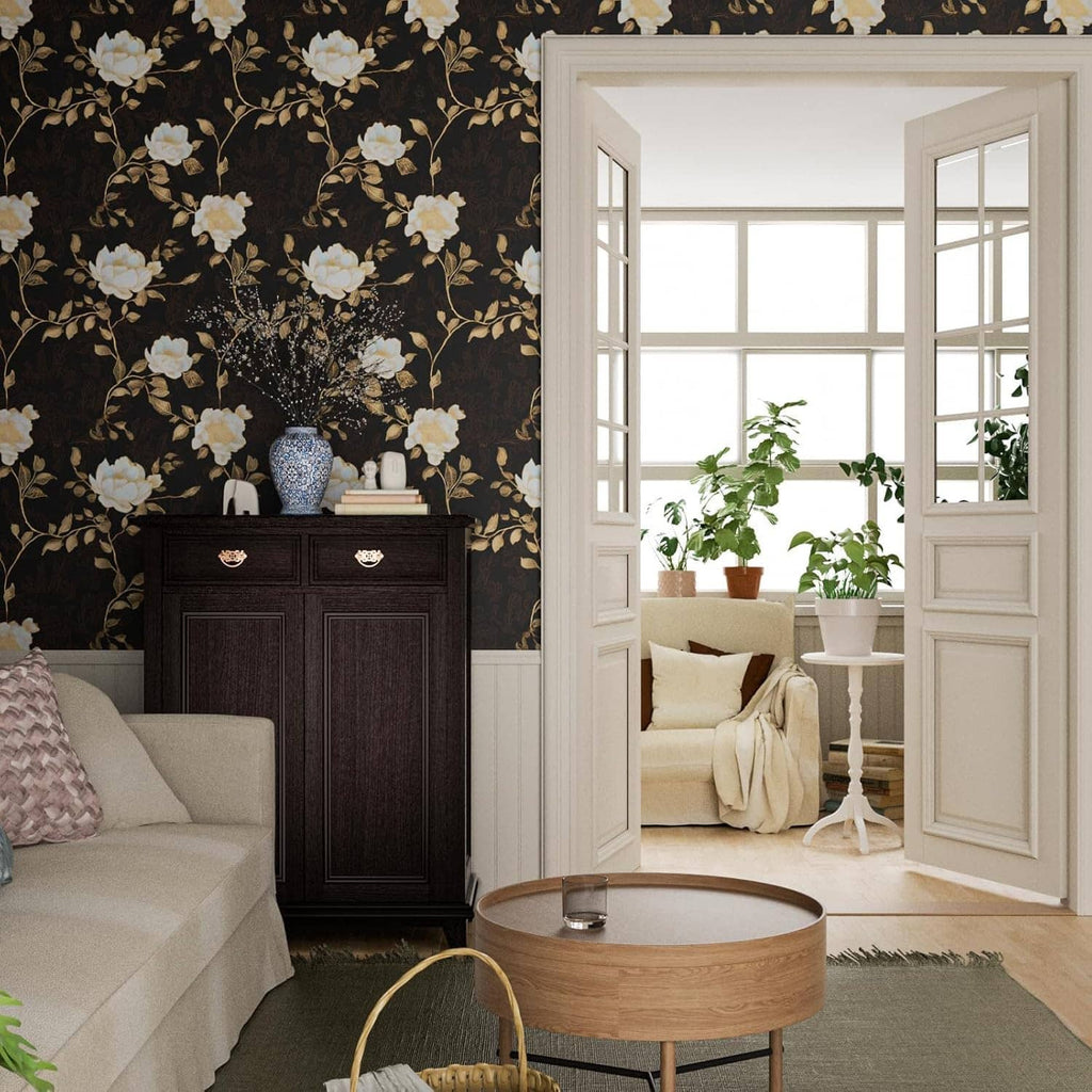 Black floral wallpaper pattern with golden roses and leaves on a room wall