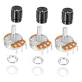 Three rotary potentiometers with black knobs and metal shafts, orange PCBs, mounting nuts and washers