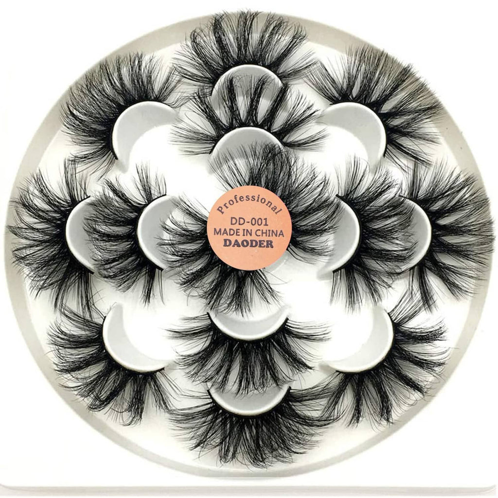 Dramatic long black faux mink-style false eyelashes on a circular tray with label.
