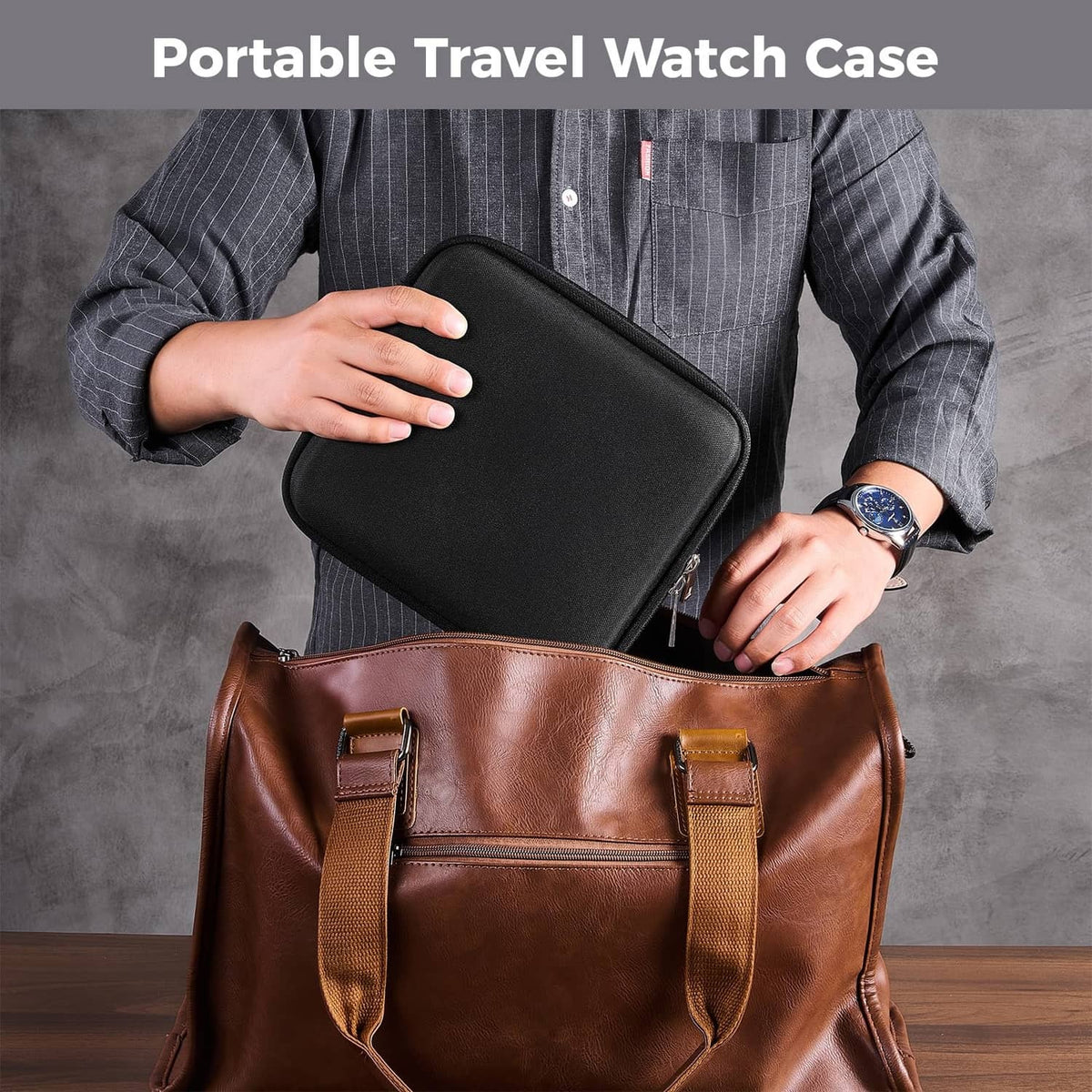 Black portable travel watch case being held, with zipper closure
