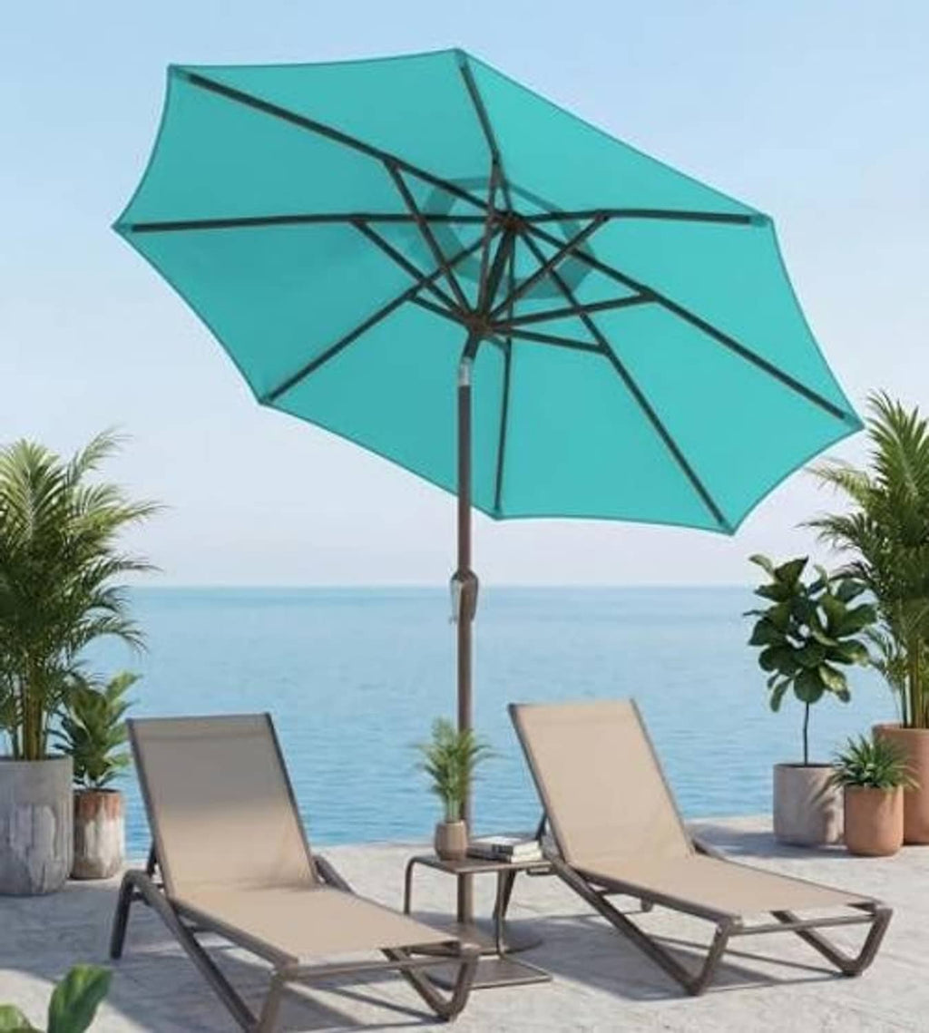 Teal patio umbrella with cross-braced canopy frame above lounge chairs