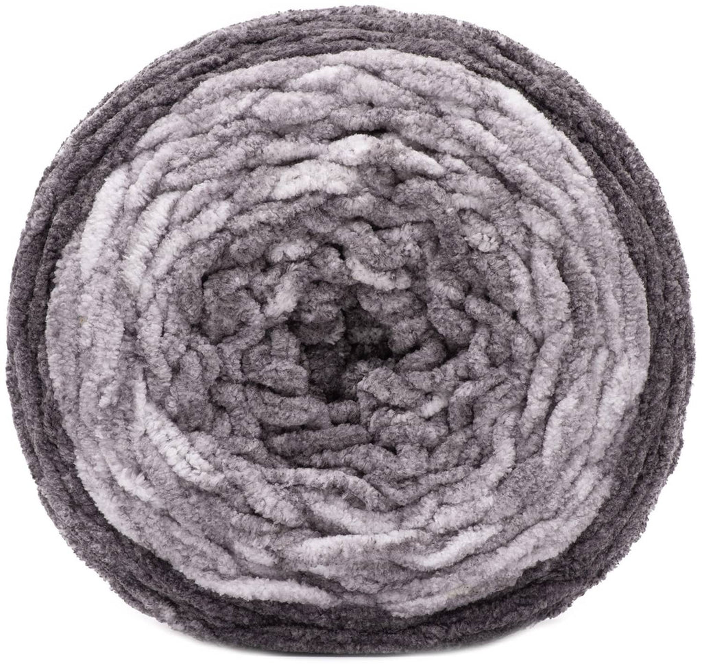 Gray dappled super bulky yarn skein close-up with thick looped texture