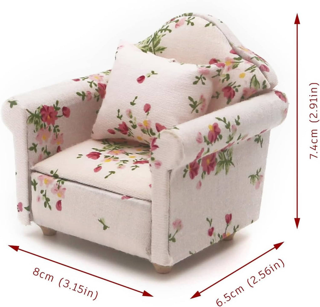 Floral miniature armchair; off-white upholstery with floral pattern, about 7.4 cm tall
