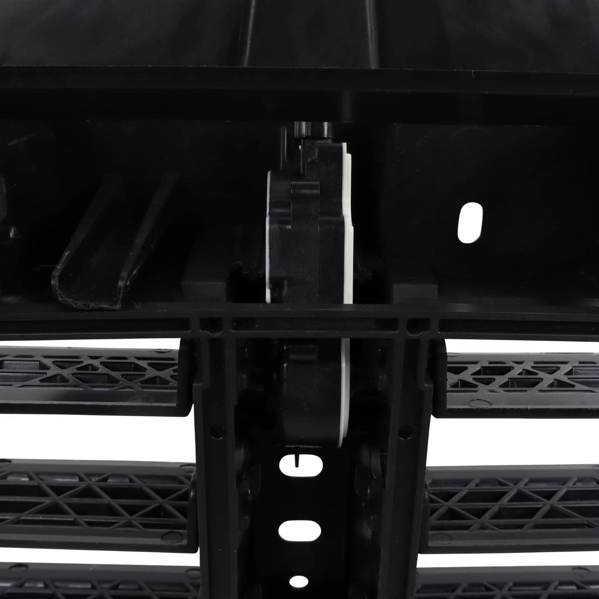 Air shutter grille bracket and linkage detail with central black actuator mount