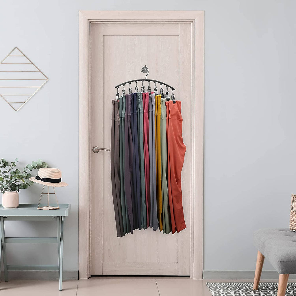 Arched legging organizer hanging with clips holding assorted folded pants