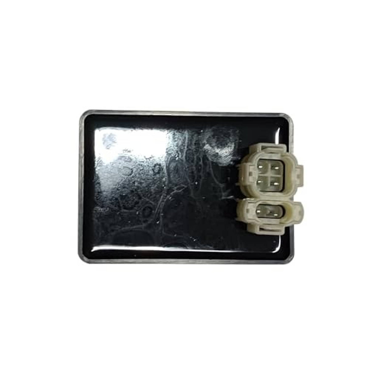 Ignition control module black housing with silver edge and light connector plugs.