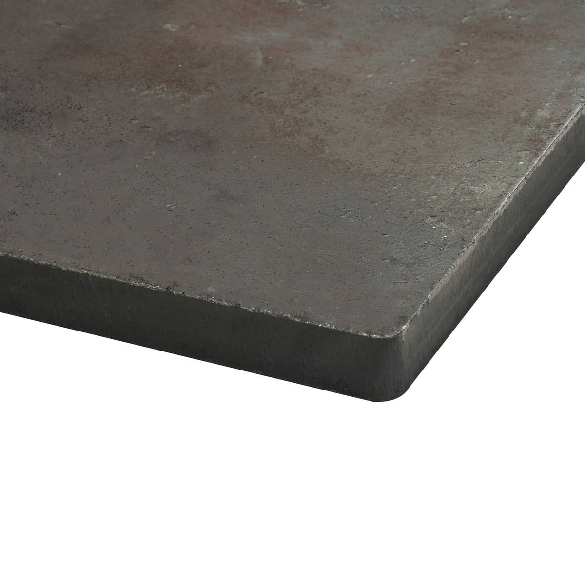Close-up of steel base plate with beveled edge and dark textured finish
