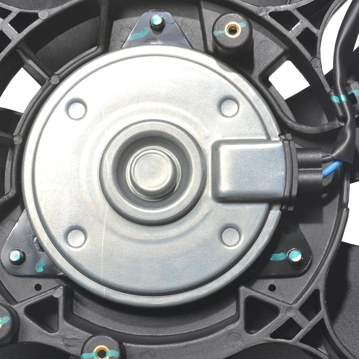 Close-up of AC condenser fan motor housing with metal mounting plate and wiring