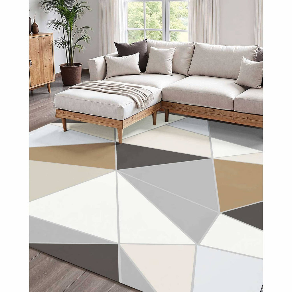 Large indoor area rug with geometric triangles in charcoal gray, beige, and white