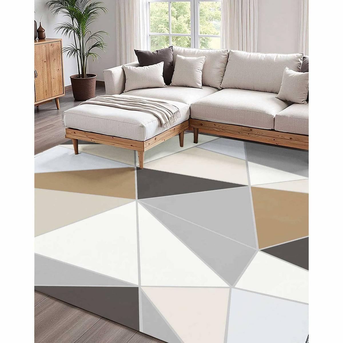 Large indoor area rug with geometric triangles in charcoal gray, beige, and white