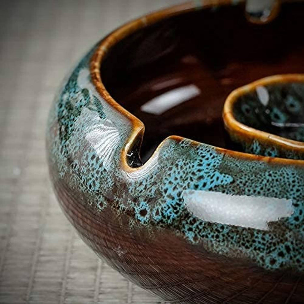 Turquoise ceramic ashtray body with bronze rim, open view showing brown interior