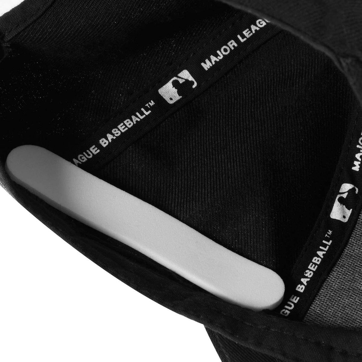 Hat sweatband insert with white foam reducer and Major League Baseball label