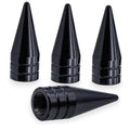 Four black cone-shaped spiked valve stem caps with ribbed grip