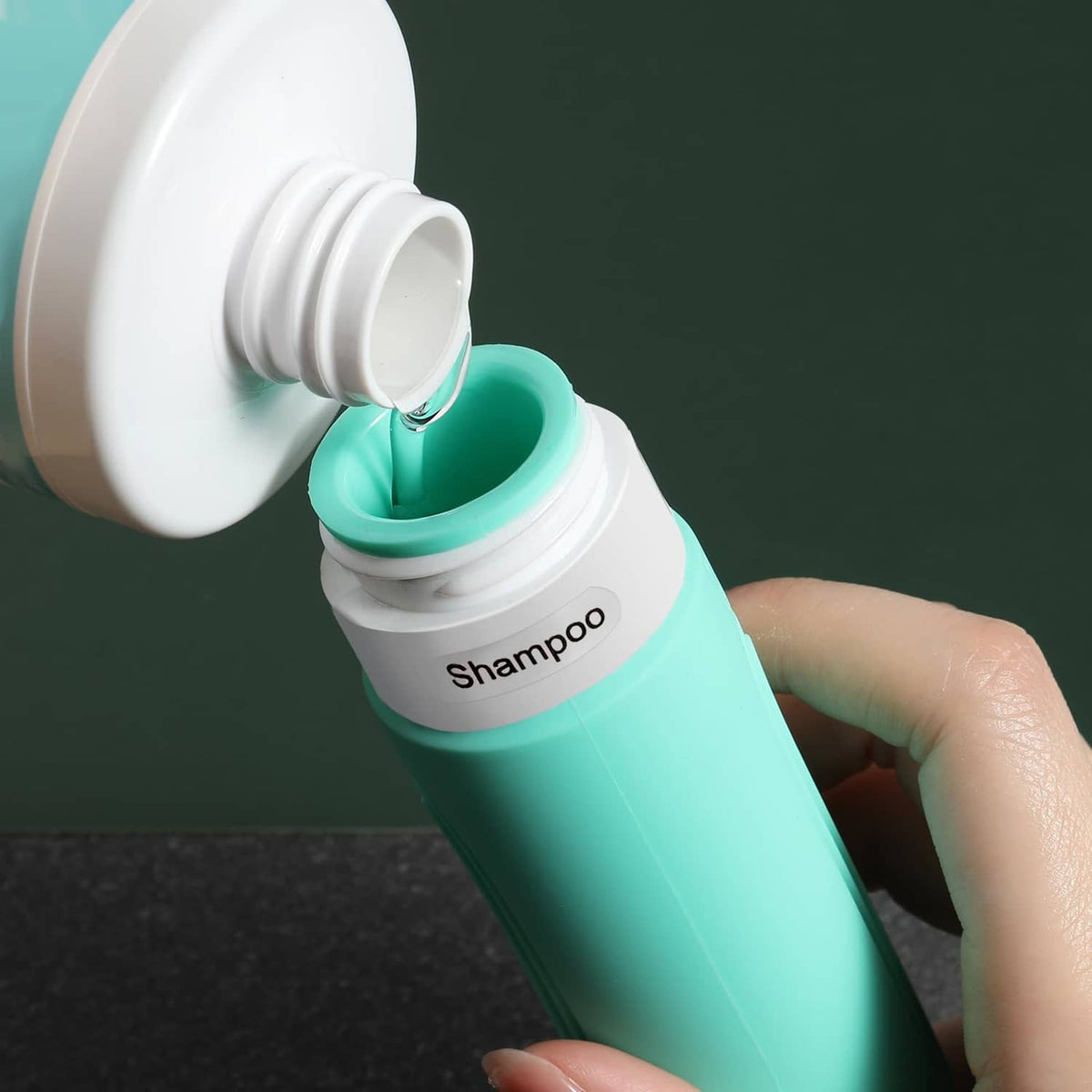 Mint green shampoo travel bottle with white flip cap open
