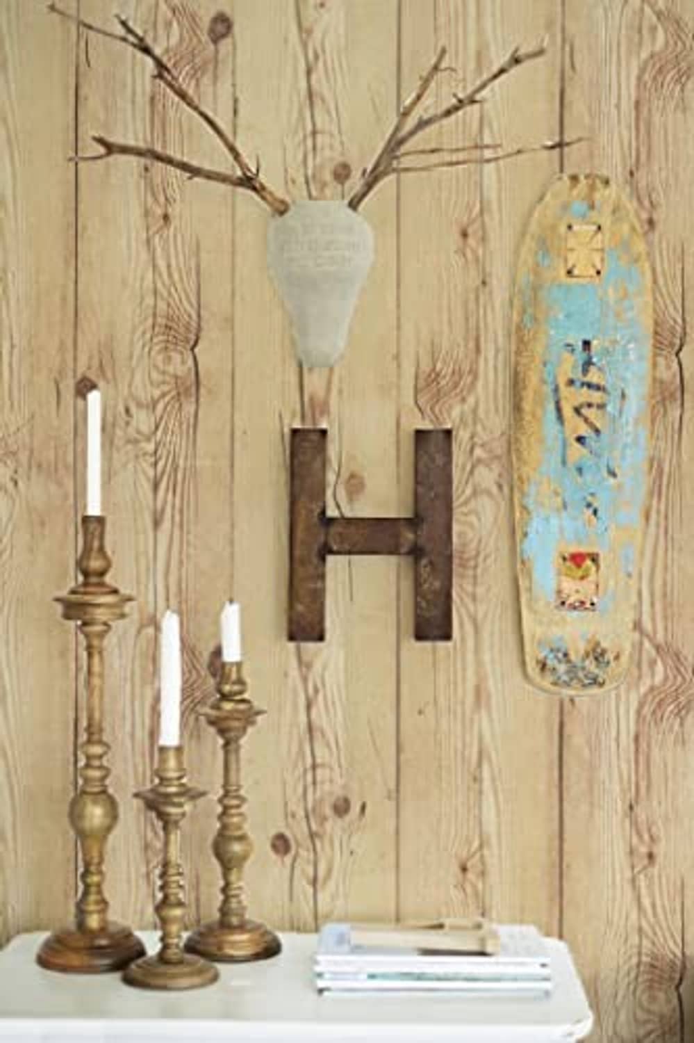 Light tan wood plank wall covering with vertical grain and dark knot details