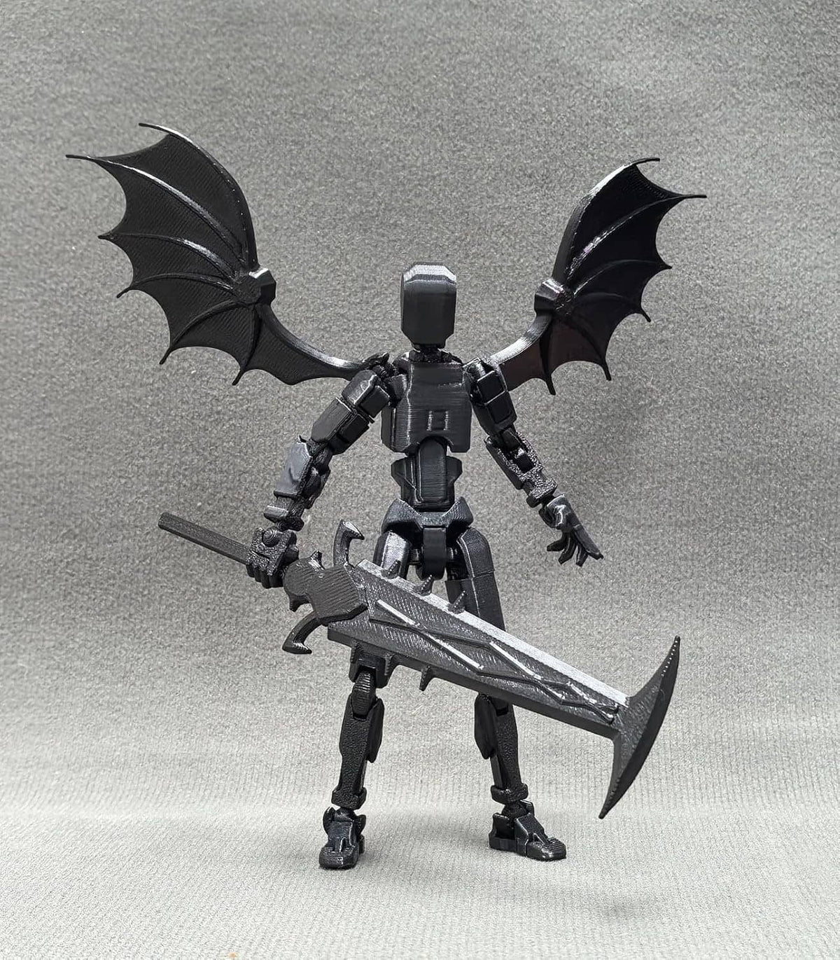 Titan 13 robot action figure with bat wings, holding a large sword