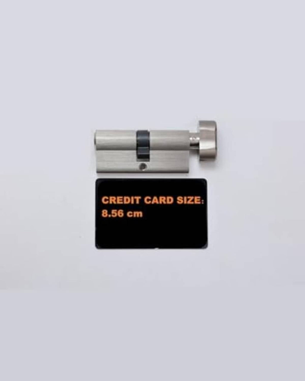 Lock cylinder with card-size reference (8.56 cm)
