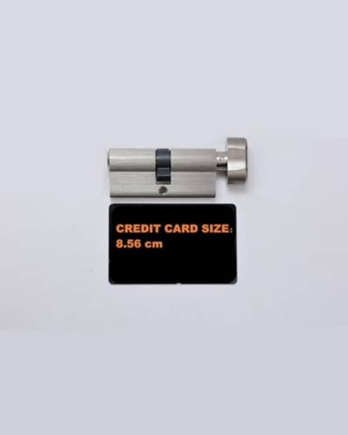 Lock cylinder with card-size reference (8.56 cm)