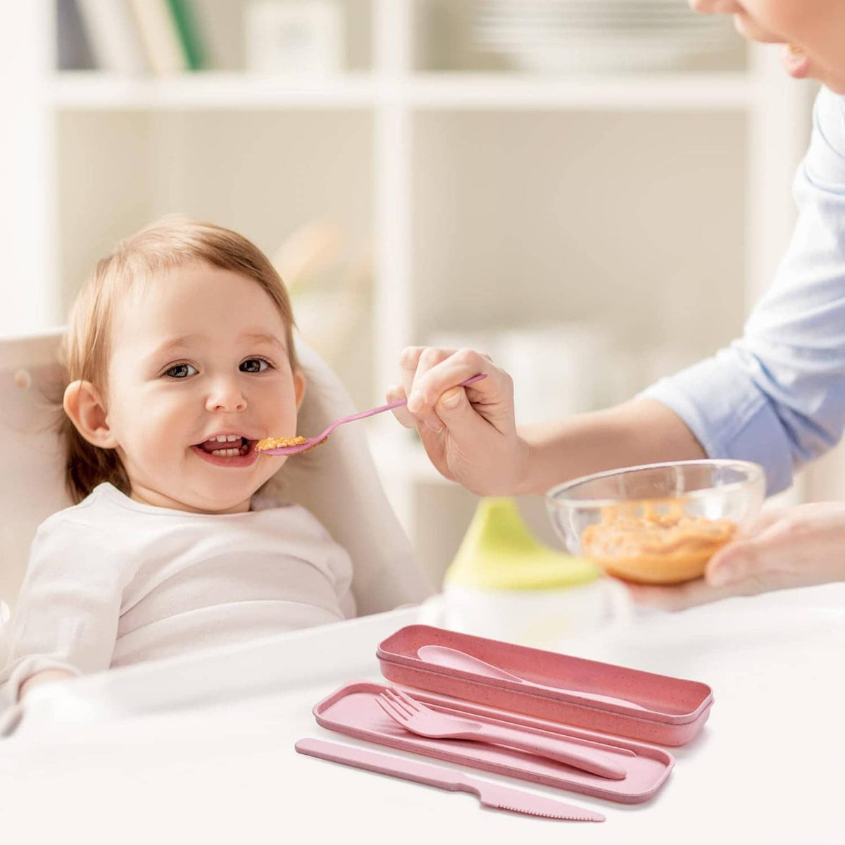 Pink reusable wheat straw cutlery set with fork and knife, shown with a carrying case