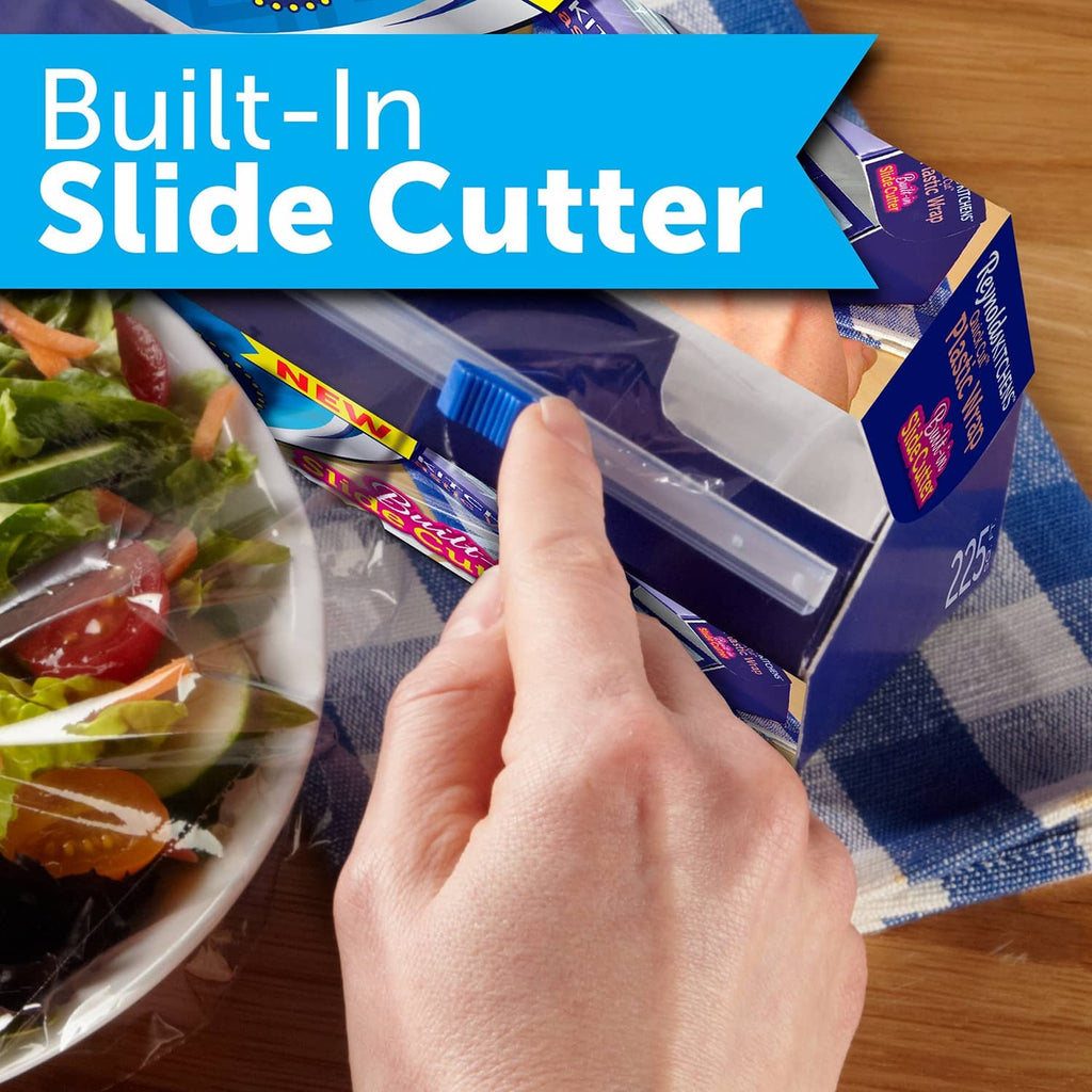 Plastic wrap dispenser showing built-in slide cutter with film aligned for cutting