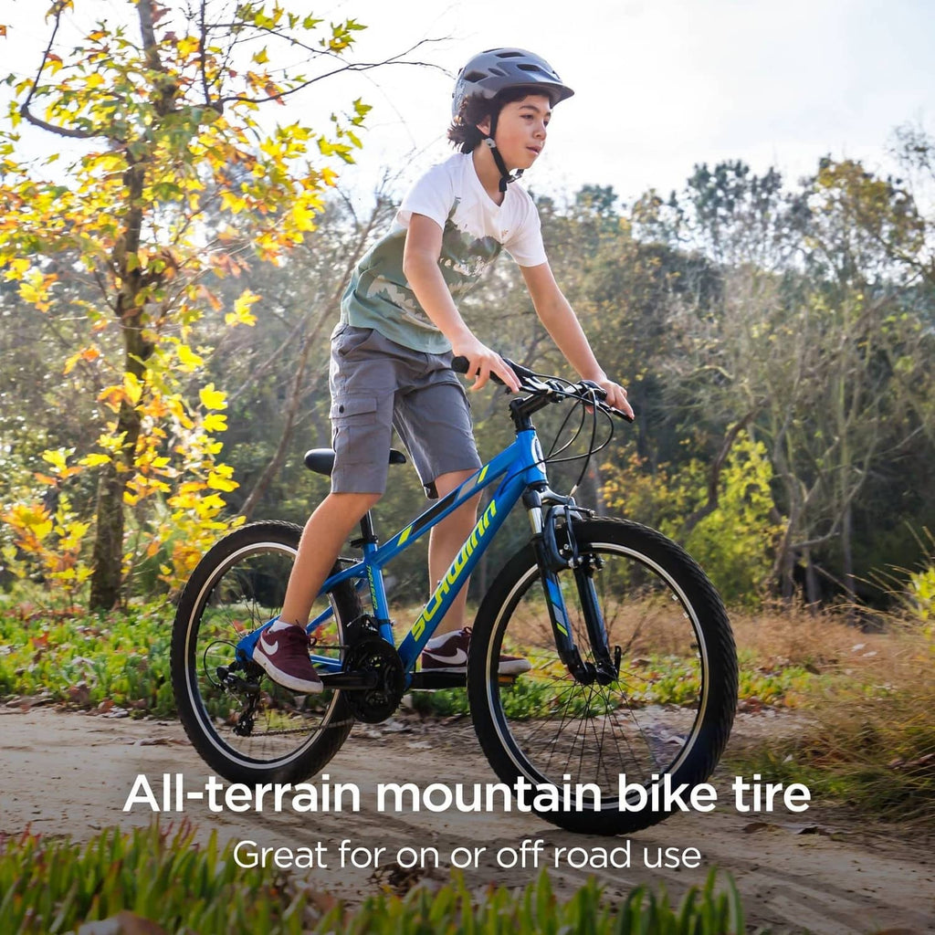 Black mountain bike tire mounted on a bicycle, knobby tread visible