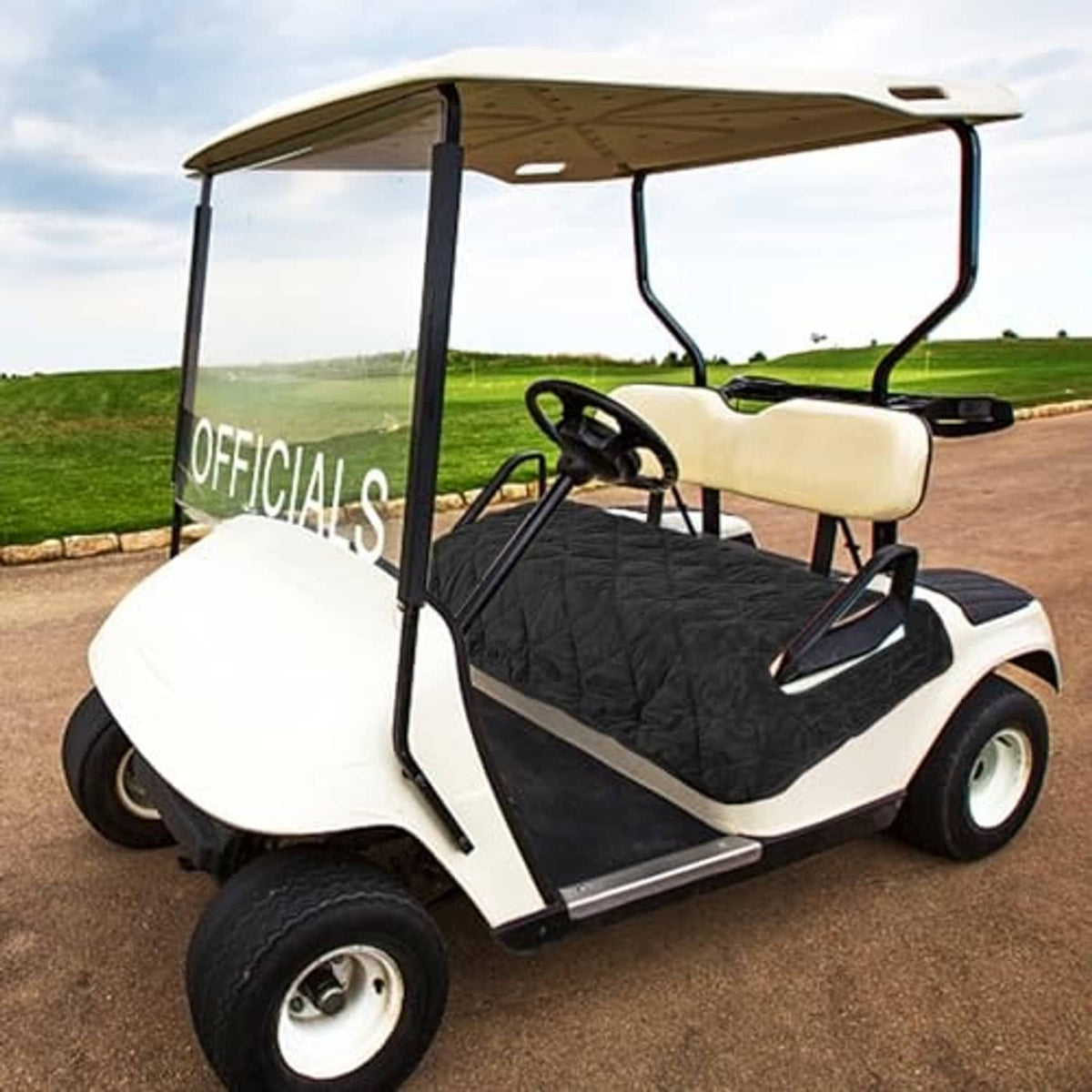 Black quilted seat cover on golf cart seat with protective side paneling
