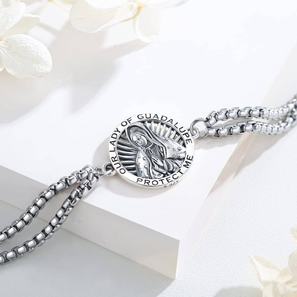 Close-up silver-tone bracelet with circular Our Lady of Guadalupe medallion