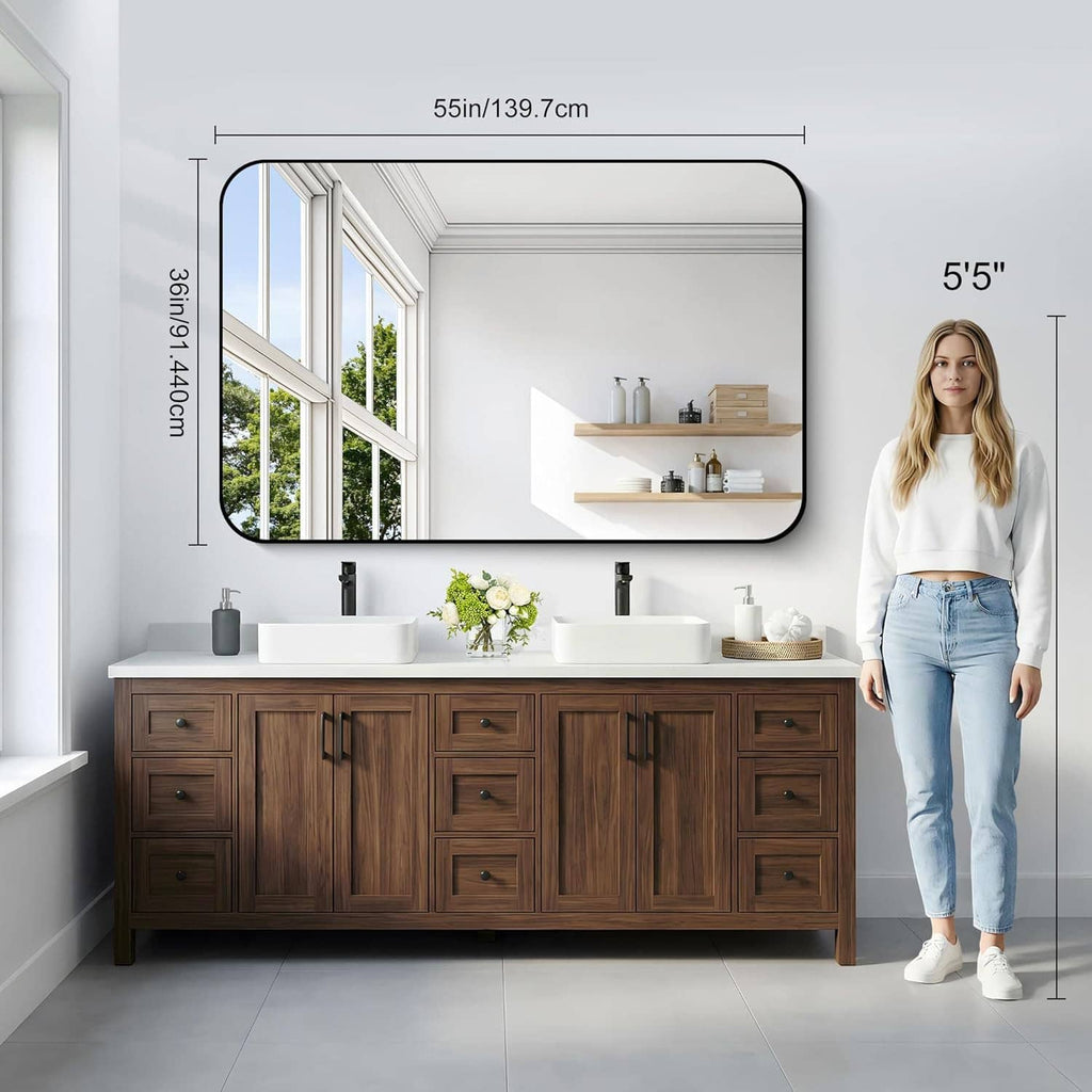 55in matte black bathroom mirror on wall above dark wood vanity
