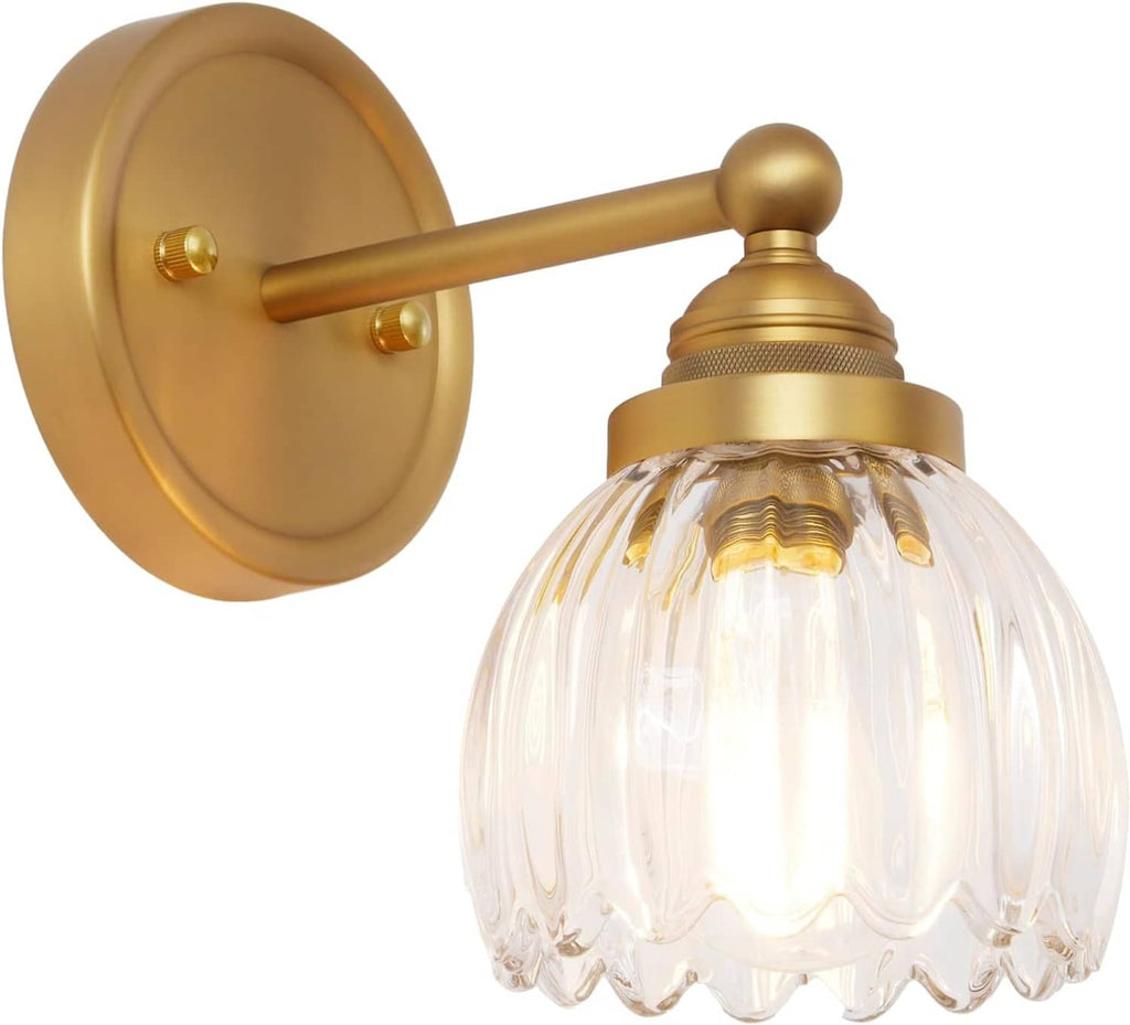 Vintage tulip glass wall sconce with clear ribbed globe-style shade and antique brass arm