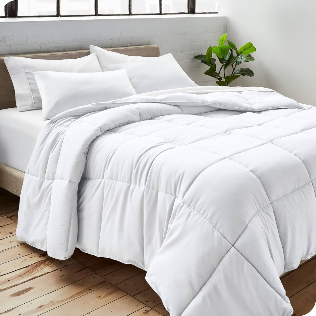 White down-alternative king comforter on bed with matching white pillows