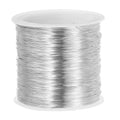 Silver-colored 28 gauge jewelry wire spool, tightly wound with copper wire
