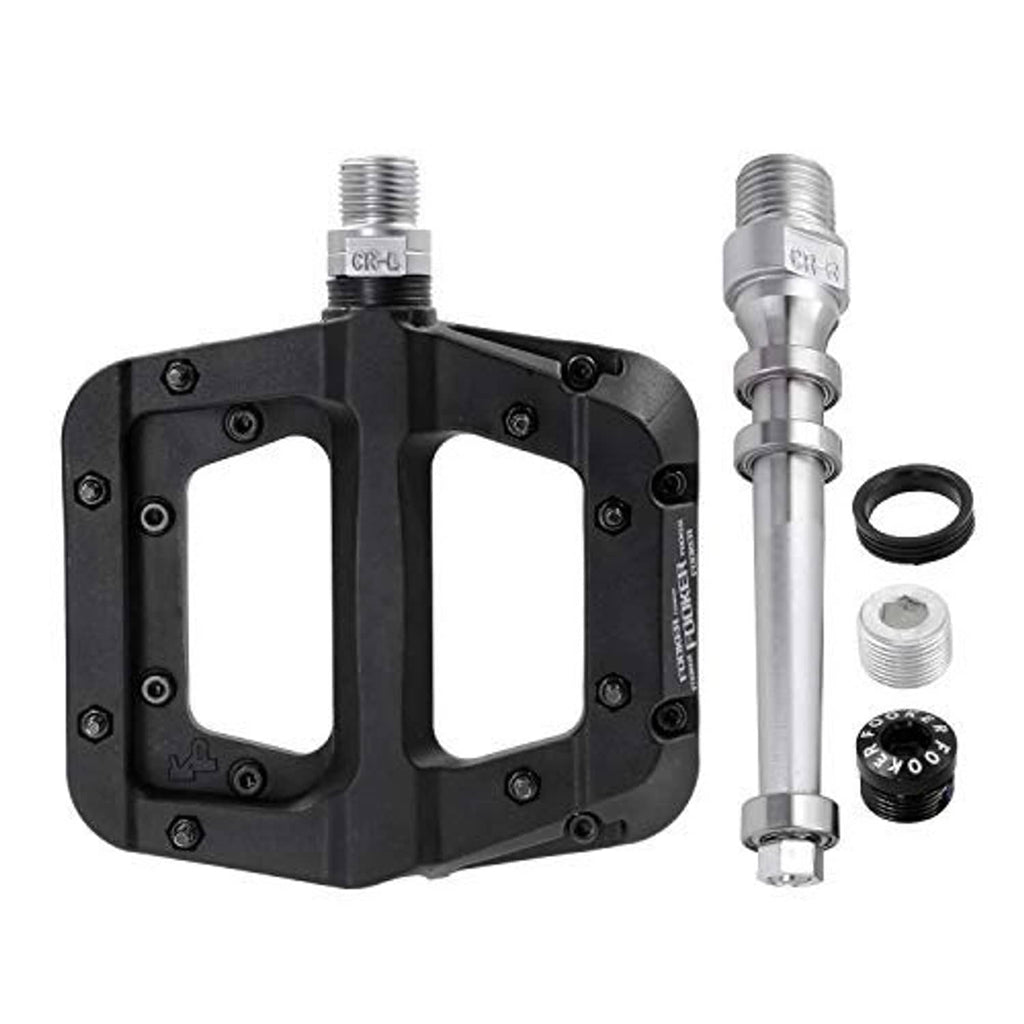 Black MTB flat pedal with threaded axle, plus included small parts and spacers