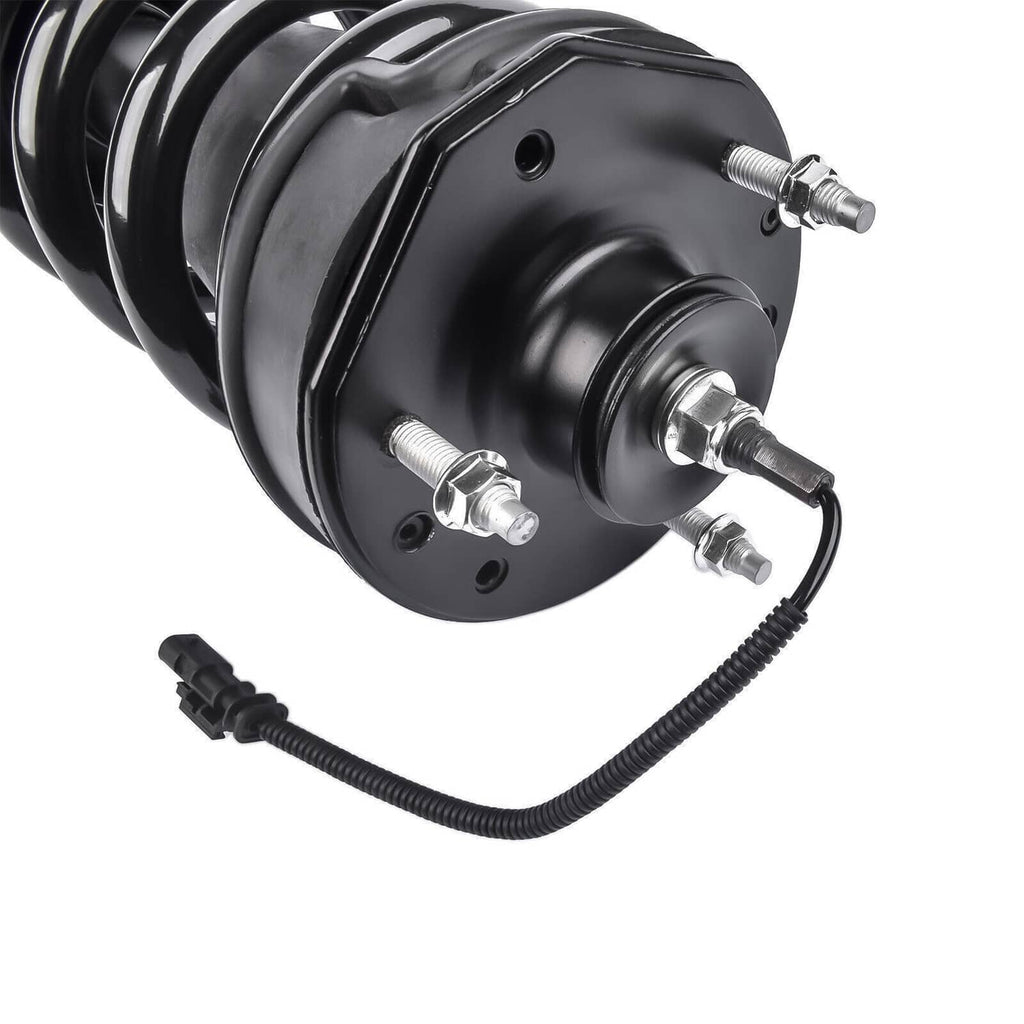 Close-up of black shock strut mount with coil spring and connector wires
