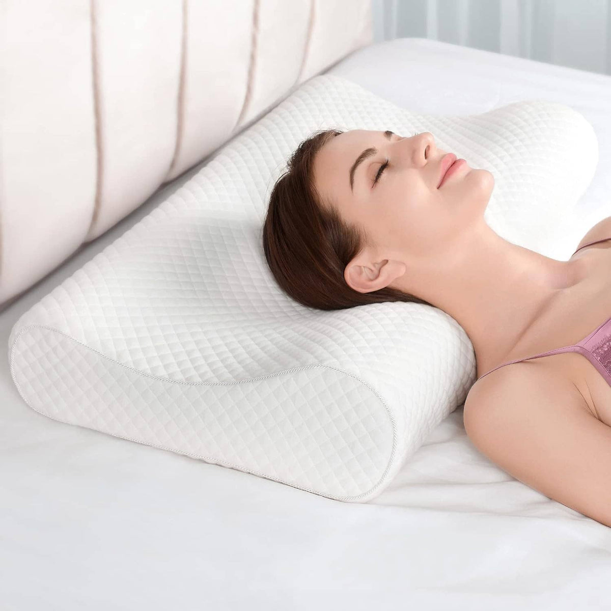 White contour memory foam neck pillow with curved support shape